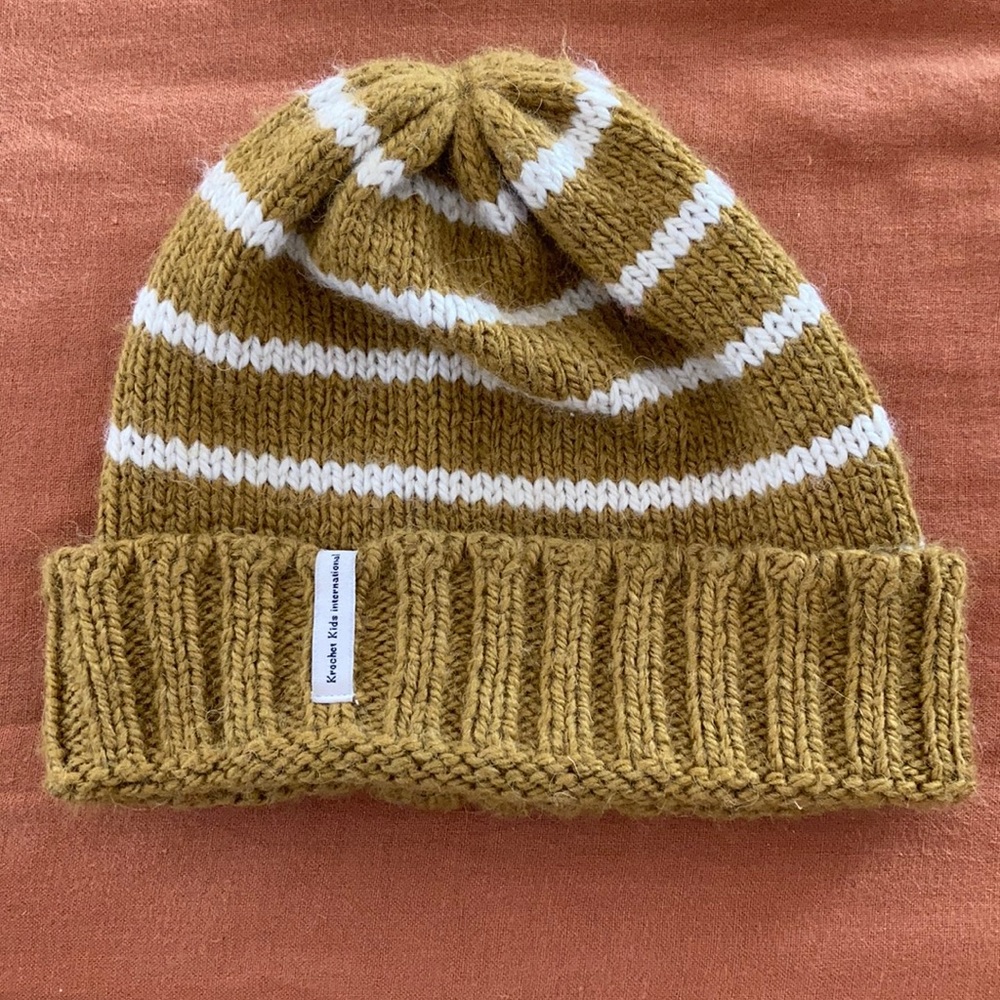 Krochet kids tan white beanie hat